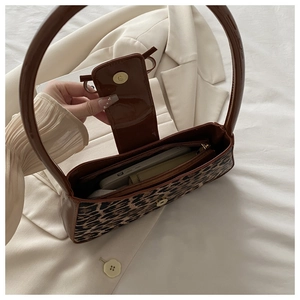 Overhead view showing the spacious interior and zipper pocket of the leopard print bag