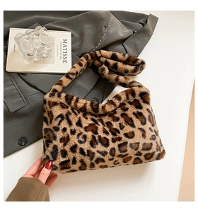 Detailed view of luxury leopard print faux fur shoulder bag with soft plush texture