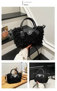 Close-up of black faux fur tote bag featuring leather handle and silver magnetic buckle