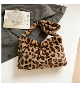 Detailed close-up of leopard print faux fur texture on a stylish women shoulder bag