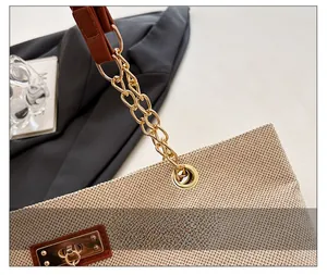 Detailed close-up of premium gold metal chain and woven texture on shoulder bag