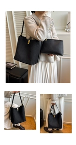 Détail du sac seau noir en suède avec ferrures dorées et pochette intérieure assortie