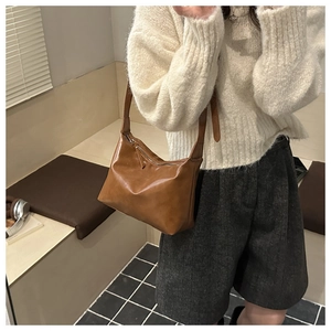 Brown vintage faux leather hobo shoulder bag styled with an autumn winter outfit