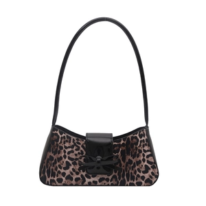 Vintage leopard print shoulder bag with black patent leather bow and curved base