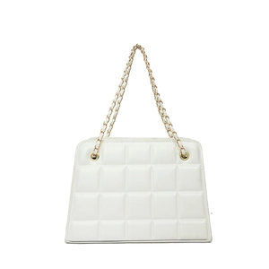 Elegant white quilted crossbody bag with gold-tone chain strap and flap closure