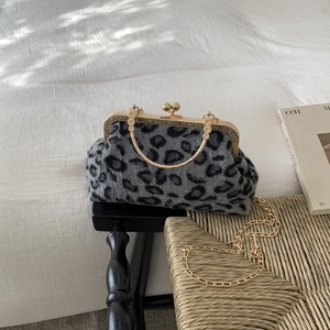 Women's leopard print shell bag with golden metal handle and chain strap for evening