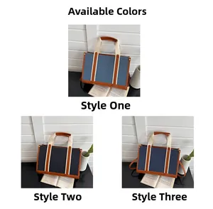 Detail view of retro canvas tote bags in light blue, dark grey and navy blue colors