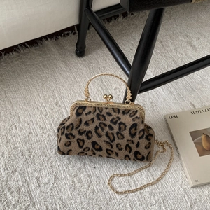 Stylish faux fur leopard print handbag with golden kiss-lock and vintage chain strap
