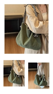 Detail of dark green corduroy tote bag with black and white striped woven shoulder strap