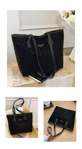 Detail of black leopard print tote bag with gold lettering and plush velvet texture