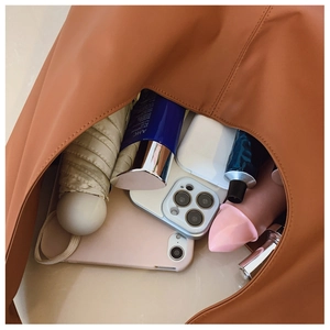 Detail view of large soft leather tote bag interior showing spacious storage capacity