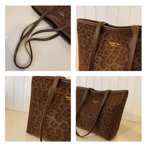 Detail of leopard print tote bag featuring fashion bag New York text and leather straps