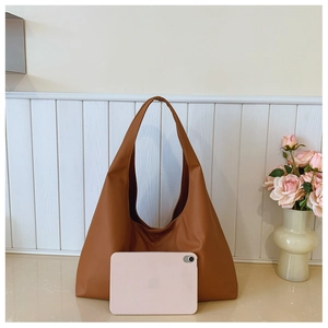 Brown large capacity tote bag detail showing interior space for a tablet and daily items