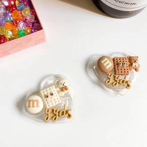 Gros plan de supports de téléphone cœur avec ours, biscuit et motif yyds mignon