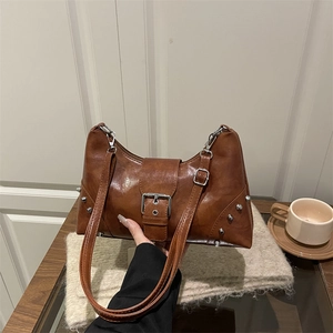 Vintage brown leather tote bag with silver rivets and metal buckle for daily wear
