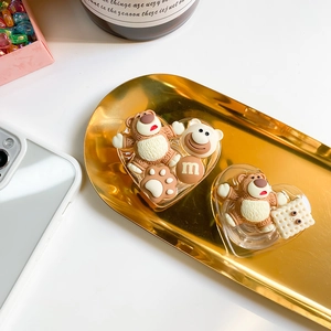 Close-up of cute 3D cartoon bear grip tok on heart-shaped base with cream glue style details