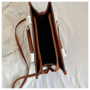 Detailed interior view of tote bag with center zip pocket and leather stitching