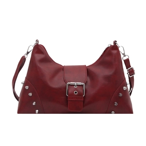 Vintage wine red hobo bag with silver rivets and adjustable strap in minimalist style