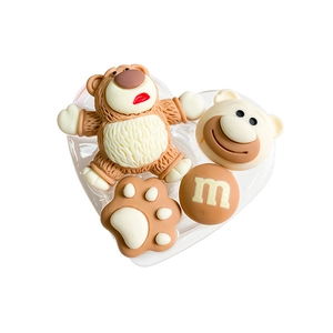 Detailed view of DIY 3D resin bear and chocolate bean accessories for phone stands