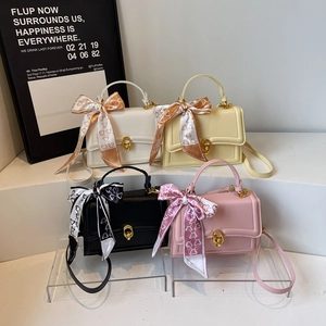 Minimalist leather crossbody square handbags with gold ring buckle and scarf detail