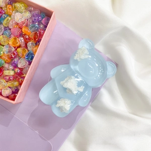Detail of a cute light blue bear phone socket with cloud filling on purple cardstock