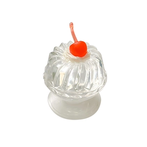 Transparent cherry dessert phone grip with red cherry topping on white background