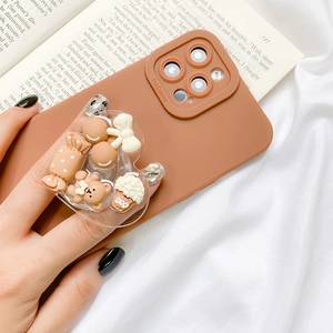 Macro shot of brown phone case with heart grip and 3D resin bear decoration