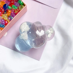 Detail of transparent cloud phone socket grip with glitter and blue-purple gradient