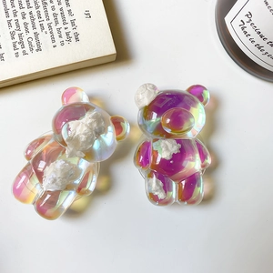Chic aurora bear phone grip with cloud accents on a clean aesthetic desk background