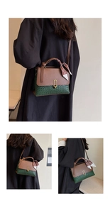 Detail of green woven shoulder bag with brown leather flap and stylish printed scarf