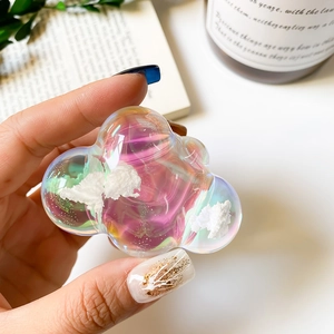 Close-up of translucent laser resin cloud phone grip with purple holographic shimmer
