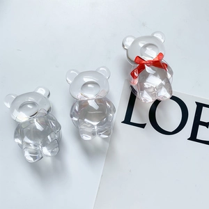 Lot de trois supports de téléphone ours en acrylique facetté avec un nœud en soie rouge