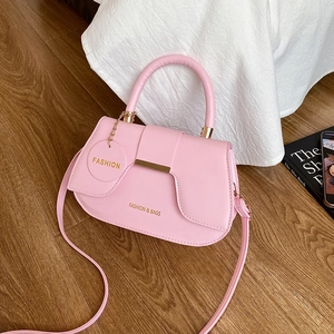 Fashionable pink PU leather saddle bag with adjustable shoulder strap and metal hardware