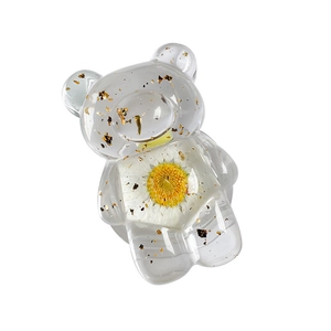 Transparent resin bear phone grip with dried daisy flower and gold foil interior