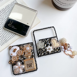 Detail of luxury Samsung Z Flip case with diamond perfume bottle and beaded strap