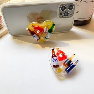 Creative heart-shaped acrylic phone grip with miniature beer bottles and liquid core