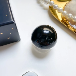 Polished black crystal ball phone grip with elegant pearl and luxury gift box detail