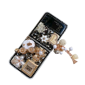Luxury black rhinestone case for Samsung Galaxy Z Flip with perfume bottle design and gold charm