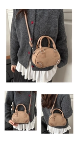 Multiple views of a mini camel suede bowling bag with rivet details and shoulder strap