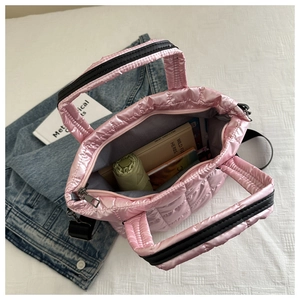 Top view of pink quilted tote bag showing large capacity for books and umbrella