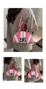 Detail showing pink and white striped shoulder bag with number 96 patch embroidery
