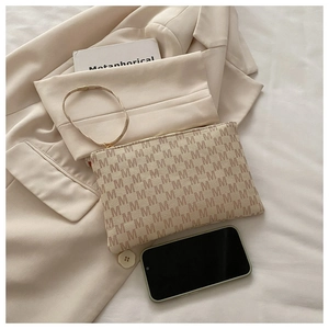 Minimalist beige envelope clutch bag with letter M pattern and matching wrist strap