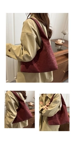 Detail view of the deep burgundy leopard print hobo shoulder bag with matte suede texture
