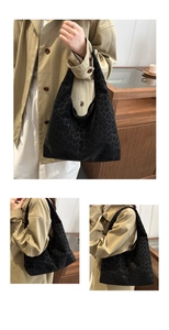 Close-up of black leopard print hobo tote bag in velvet fabric with matte finish