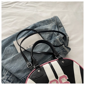 Detail of tricolor striped shoulder bag with star rivets and 06 number patch