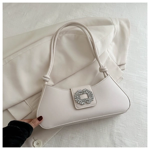 Elegant cream baguette shoulder bag with oversized crystal square buckle detail