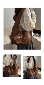 Close-up of brown pebbled leather hobo bag with star-shaped rivet studs for daily commuting