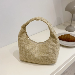 Chic cream woven straw hobo handbag with knot handle detail for summer vacation style