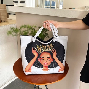 Detailed view of the large canvas tote bag with thick cotton rope handles and cartoon print