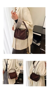 Detail of vintage dark brown suede tote bag with gold hardware and shoulder strap